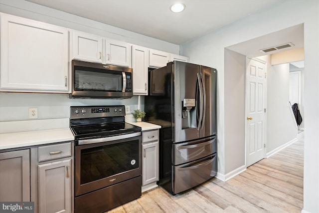 3331 Arundel On The Bay Rd, Annapolis, MD 21403 - kitchen with stainless steel appliances, light wood-style flooring, light countertops, baseboards, and recessed lighting