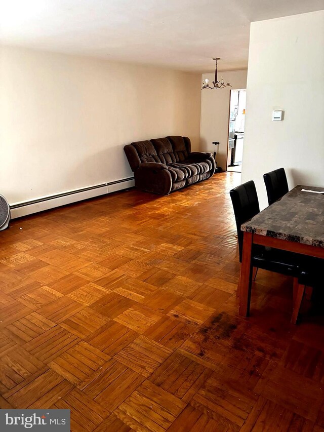446 N Daggett St, Philadelphia, PA 19151 - dining space featuring a chandelier and a baseboard radiator
