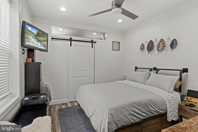 1807 N 27th St, Philadelphia, PA 19121 - bedroom featuring a barn door, wood finished floors, recessed lighting, ceiling fan, and a closet