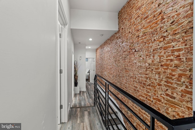 1807 N 27th St, Philadelphia, PA 19121 - hallway with wood finished floors, brick wall, and recessed lighting