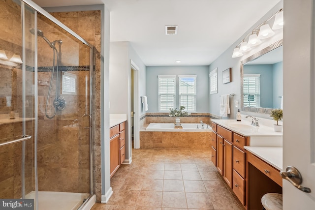 full bathroom with a shower stall, a bath, vanity, and tile patterned floors