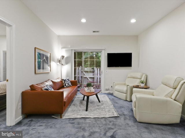 living area with carpet and recessed lighting