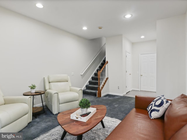 carpeted living room with stairs, recessed lighting, and baseboards