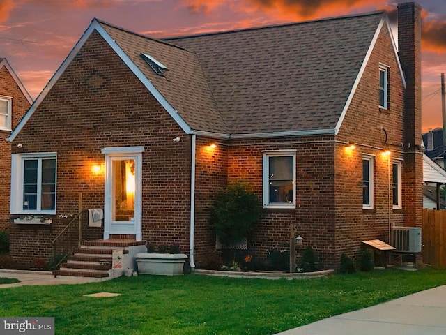 1918 Maxwell Ave, Baltimore, MD 21222 - view of front of property with entry steps, brick siding, a chimney, central air condition unit, and roof with shingles