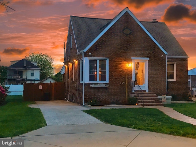 1918 Maxwell Ave, Baltimore, MD 21222 - view of front of house with brick siding, driveway, and a shingled roof
