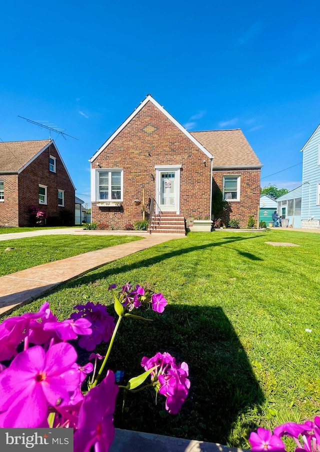 1918 Maxwell Ave, Baltimore, MD 21222 - bungalow-style home featuring brick siding, entry steps, and a front lawn
