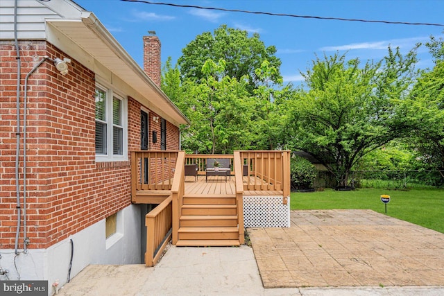 wooden terrace with a patio area
