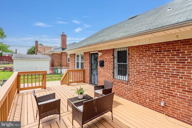 deck featuring fence and outdoor lounge area
