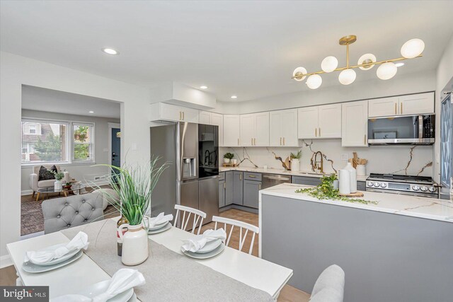 dining area featuring recessed lighting and baseboards