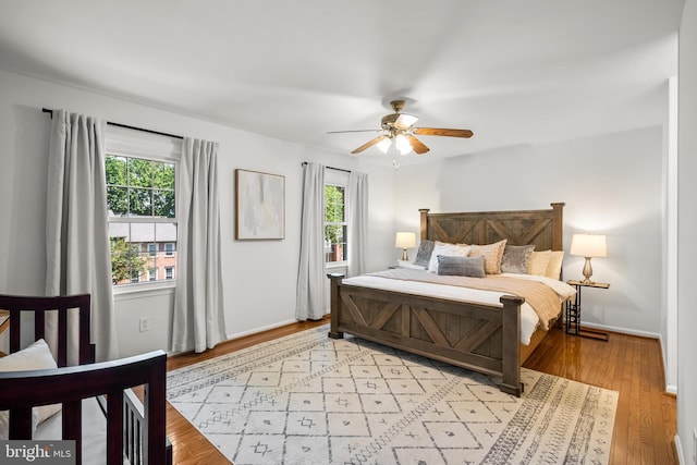 3901 Bradwater St, Fairfax, VA 22031 - bedroom featuring multiple windows, light wood-type flooring, and ceiling fan