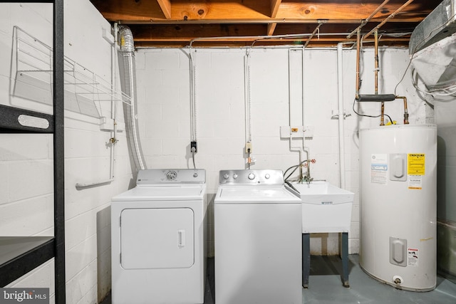 3901 Bradwater St, Fairfax, VA 22031 - laundry area featuring electric water heater, independent washer and dryer, and concrete block wall