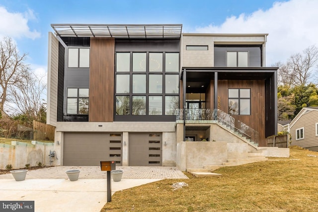 3554 Military Rd, Arlington, VA 22207 - contemporary house with driveway, a garage, stairway, and a front yard