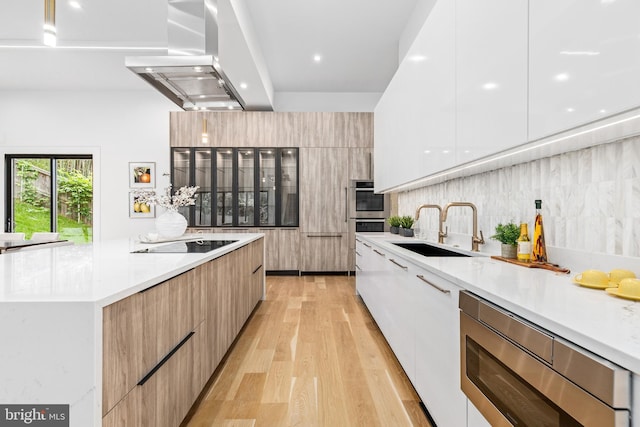 3554 Military Rd, Arlington, VA 22207 - kitchen with modern cabinets, island range hood, stainless steel appliances, a sink, and recessed lighting