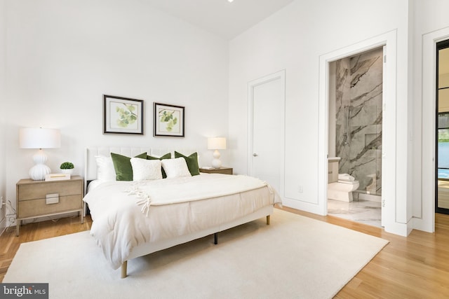 3554 Military Rd, Arlington, VA 22207 - bedroom with wood finished floors, baseboards, and ensuite bathroom