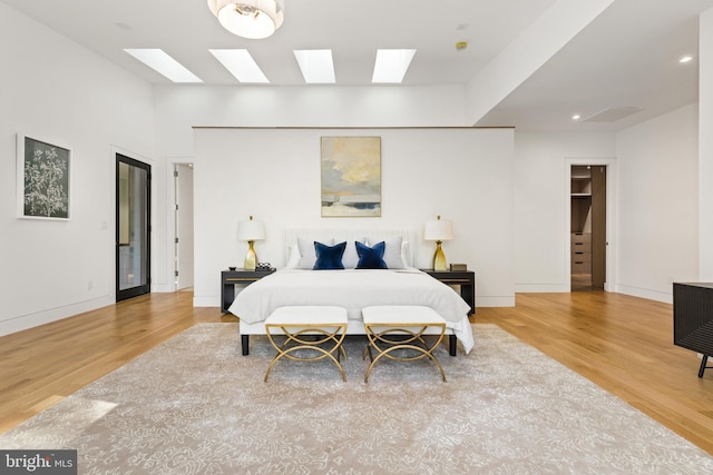 3554 Military Rd, Arlington, VA 22207 - bedroom with a skylight, wood finished floors, baseboards, and recessed lighting
