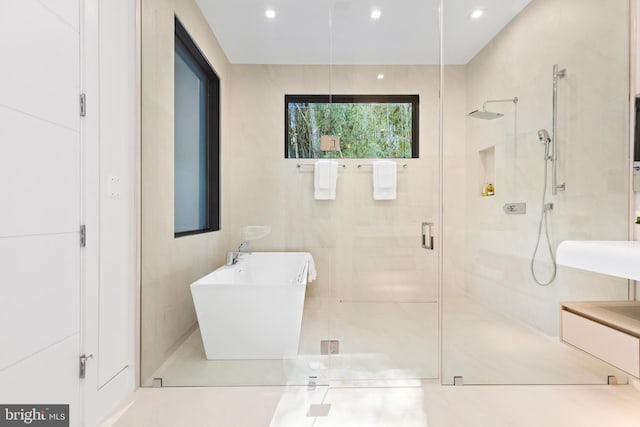 3554 Military Rd, Arlington, VA 22207 - full bathroom featuring a stall shower, a sink, recessed lighting, and tile patterned flooring