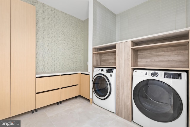 3554 Military Rd, Arlington, VA 22207 - laundry room featuring washing machine and clothes dryer, light tile patterned floors, and wallpapered walls