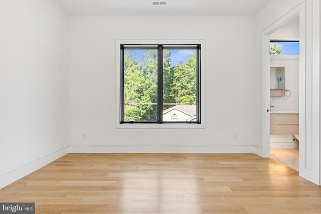 3554 Military Rd, Arlington, VA 22207 - empty room featuring light wood-style flooring and baseboards