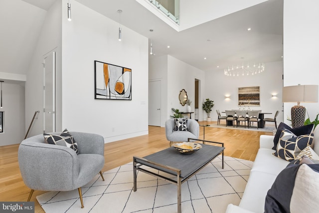 3554 Military Rd, Arlington, VA 22207 - living area featuring a high ceiling, a chandelier, light wood-type flooring, recessed lighting, and baseboards