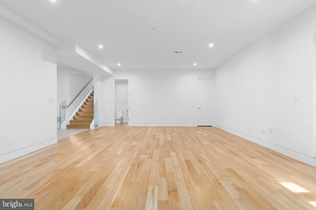 3554 Military Rd, Arlington, VA 22207 - unfurnished room with stairway, light wood-style flooring, recessed lighting, and baseboards