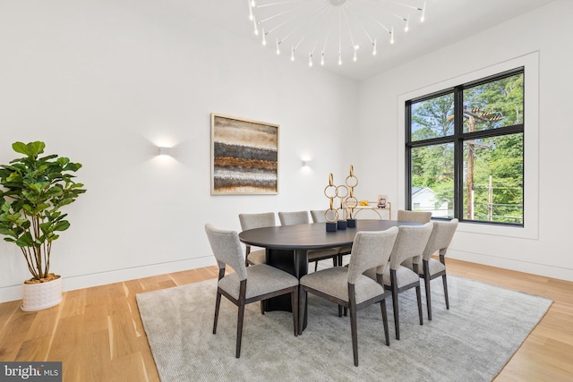 3554 Military Rd, Arlington, VA 22207 - dining space with light wood-style floors, rail lighting, and baseboards