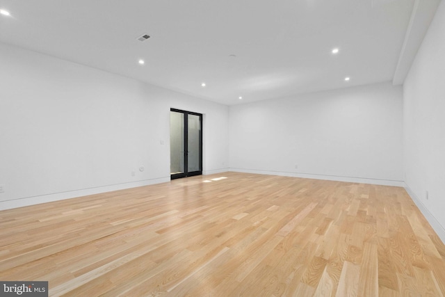 3554 Military Rd, Arlington, VA 22207 - empty room featuring light wood-style flooring, recessed lighting, and baseboards