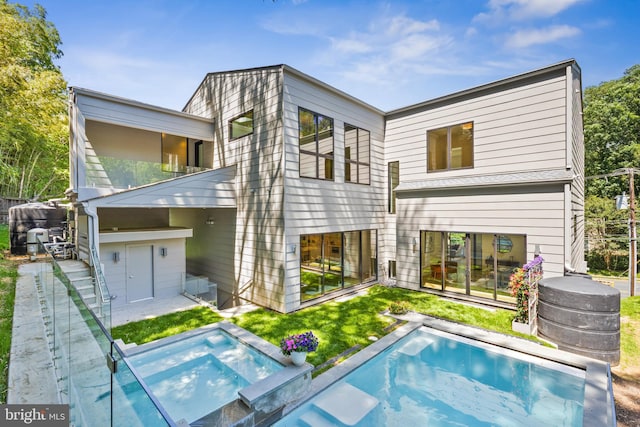 3554 Military Rd, Arlington, VA 22207 - back of property featuring an in-ground hot tub and an outdoor pool