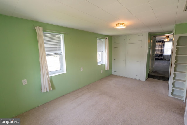 334 Windsor St, Wyomissing, PA 19610 - unfurnished bedroom with multiple windows, carpet flooring, and a closet