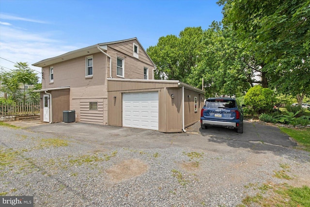 334 Windsor St, Wyomissing, PA 19610 - view of property exterior featuring a garage and central AC unit