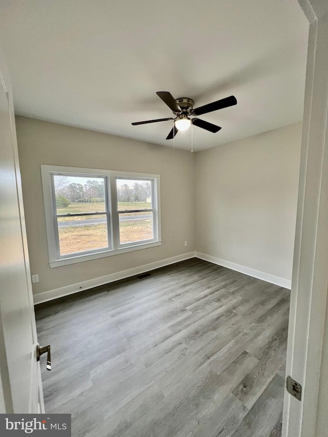 826 S Glebe Rd, Montross, VA 22520 - unfurnished room featuring healthy amount of natural light, baseboards, and ceiling fan