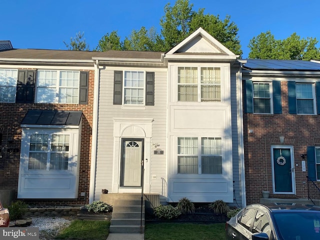 106 Perth Amboy Ct, Upper Marlboro, MD 20774 - townhome / multi-family property with roof mounted solar panels and brick siding