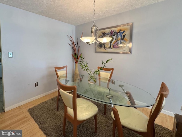 106 Perth Amboy Ct, Upper Marlboro, MD 20774 - dining area featuring a textured ceiling, light wood-type flooring, and baseboards