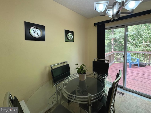 106 Perth Amboy Ct, Upper Marlboro, MD 20774 - dining space featuring stone finish floors and a textured ceiling