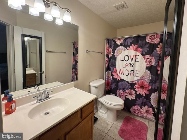 106 Perth Amboy Ct, Upper Marlboro, MD 20774 - bathroom featuring tile patterned flooring, vanity, toilet, a textured ceiling, and a shower with shower curtain
