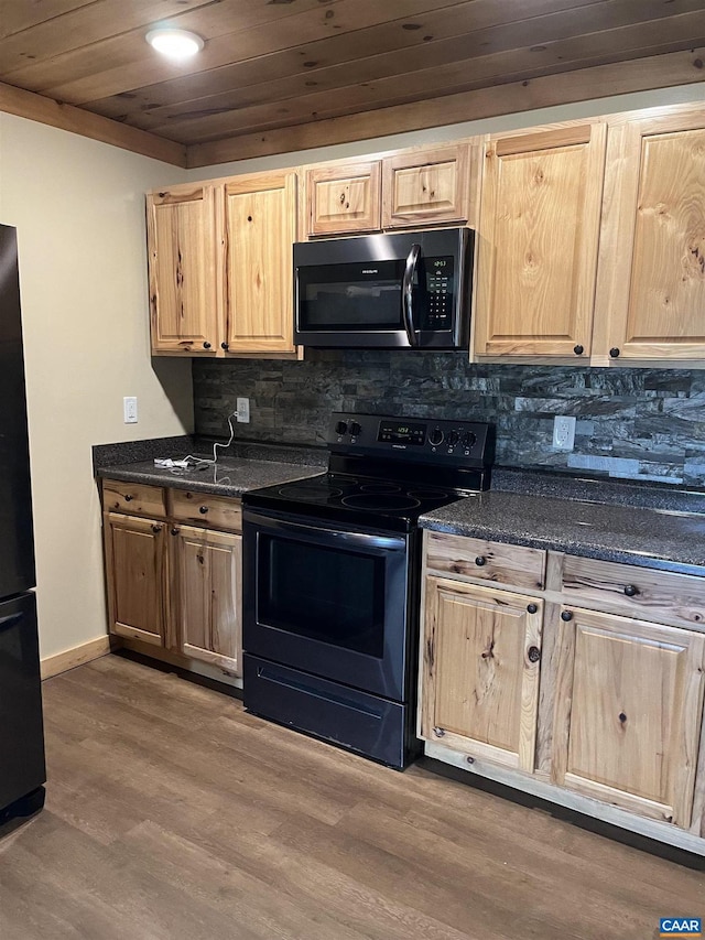 kitchen featuring range with electric stovetop, light brown cabinetry, and wooden ceiling