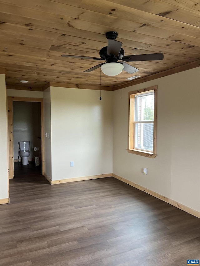 unfurnished room featuring wood ceiling, ceiling fan, baseboards, and wood finished floors