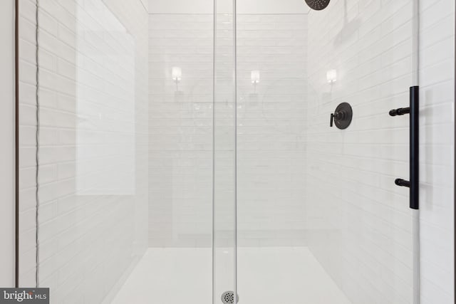 bathroom with a shower stall