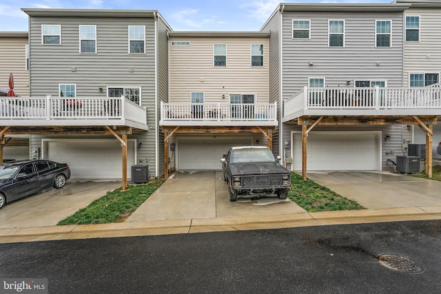 2314 Emerson Ln, Fredericksburg, VA 22401 - back of house with a garage, cooling unit, and driveway