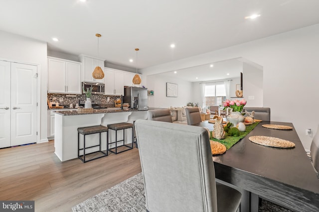 2314 Emerson Ln, Fredericksburg, VA 22401 - dining area with light wood finished floors and recessed lighting
