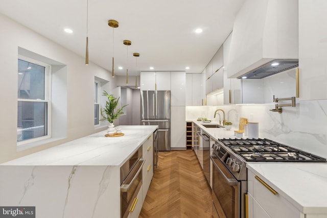 728 S Warnock St, Philadelphia, PA 19147 - kitchen with appliances with stainless steel finishes, custom exhaust hood, modern cabinets, a sink, and white cabinets