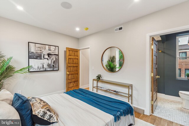 728 S Warnock St, Philadelphia, PA 19147 - bedroom featuring wood finished floors, baseboards, ensuite bath, and recessed lighting