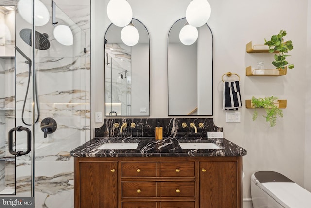 728 S Warnock St, Philadelphia, PA 19147 - full bathroom with a marble finish shower, toilet, and double vanity