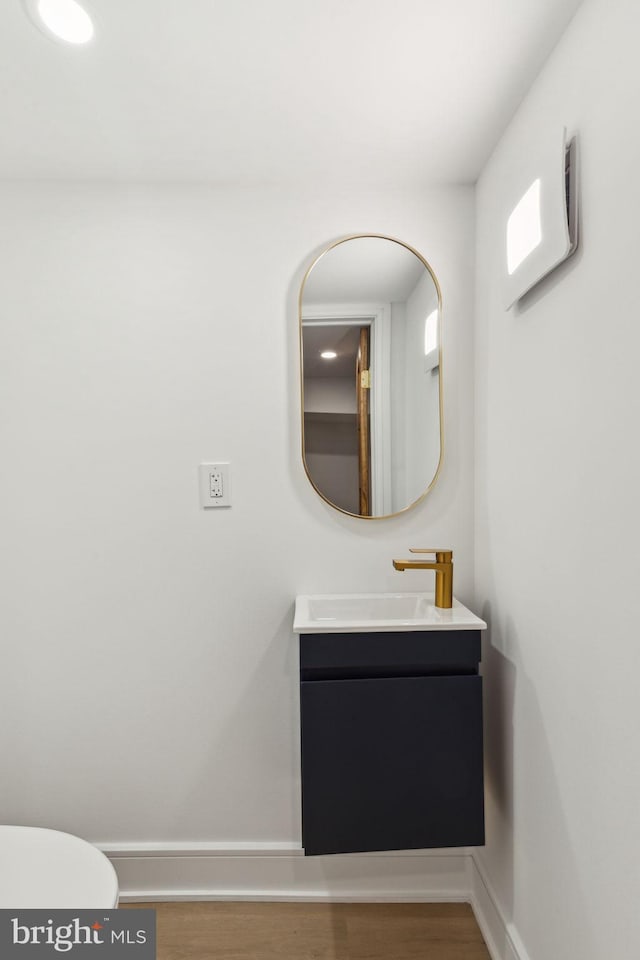 728 S Warnock St, Philadelphia, PA 19147 - bathroom featuring wood finished floors, vanity, baseboards, and toilet