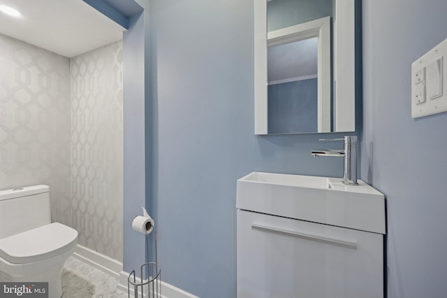 1321 Wolf St, Philadelphia, PA 19148 - half bathroom with toilet, baseboards, and vanity