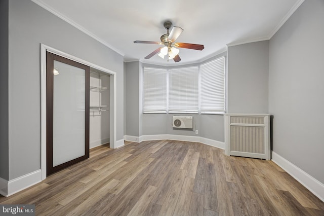 1321 Wolf St, Philadelphia, PA 19148 - unfurnished room featuring wood finished floors, ceiling fan, ornamental molding, baseboards, and heating unit