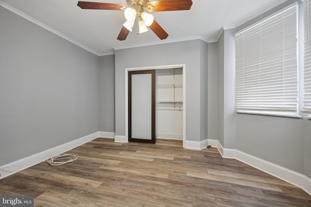 1321 Wolf St, Philadelphia, PA 19148 - unfurnished bedroom with baseboards, a closet, ornamental molding, wood finished floors, and a ceiling fan