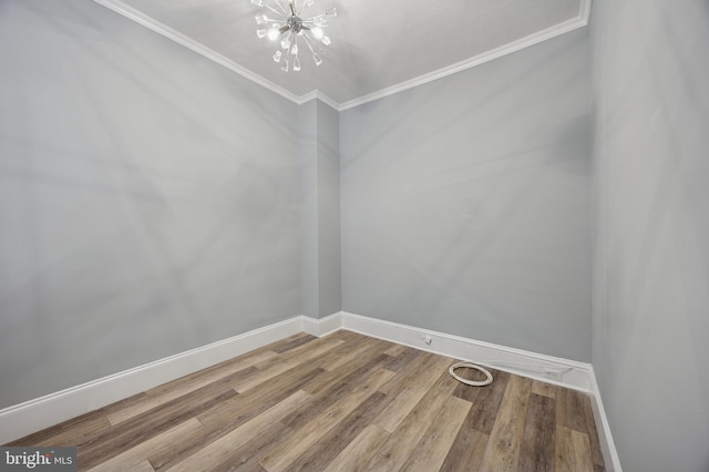 1321 Wolf St, Philadelphia, PA 19148 - empty room featuring a chandelier, baseboards, ornamental molding, and wood finished floors
