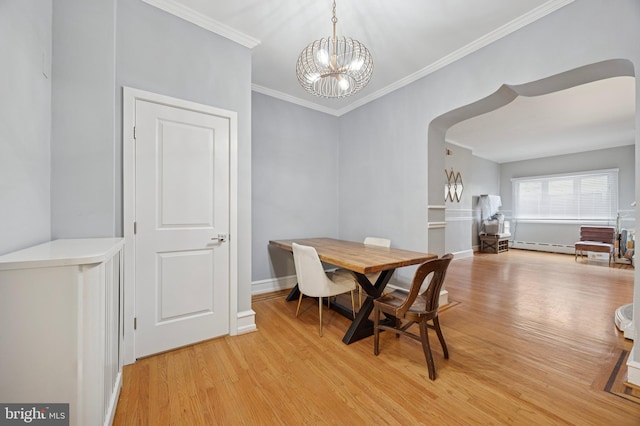 1321 Wolf St, Philadelphia, PA 19148 - dining room with light wood-style flooring, a chandelier, ornamental molding, arched walkways, and baseboard heating