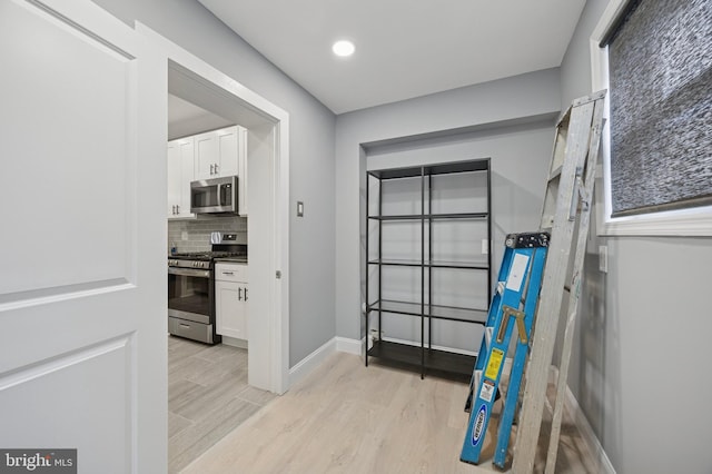 1321 Wolf St, Philadelphia, PA 19148 - hall with light wood finished floors, baseboards, and recessed lighting