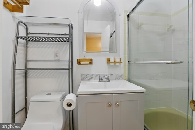 full bathroom featuring vanity and toilet